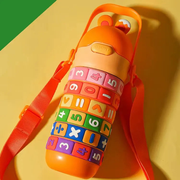 Colorful children's water bottle with number and letter patterns on a yellow background