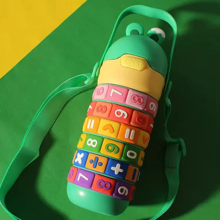 Colorful water bottle with textured surface on a green background
